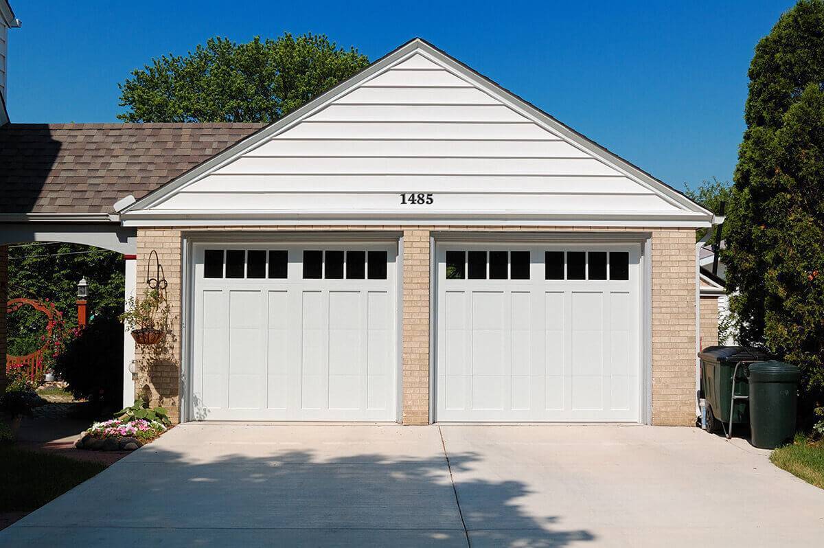 Home with white dual garage doors
